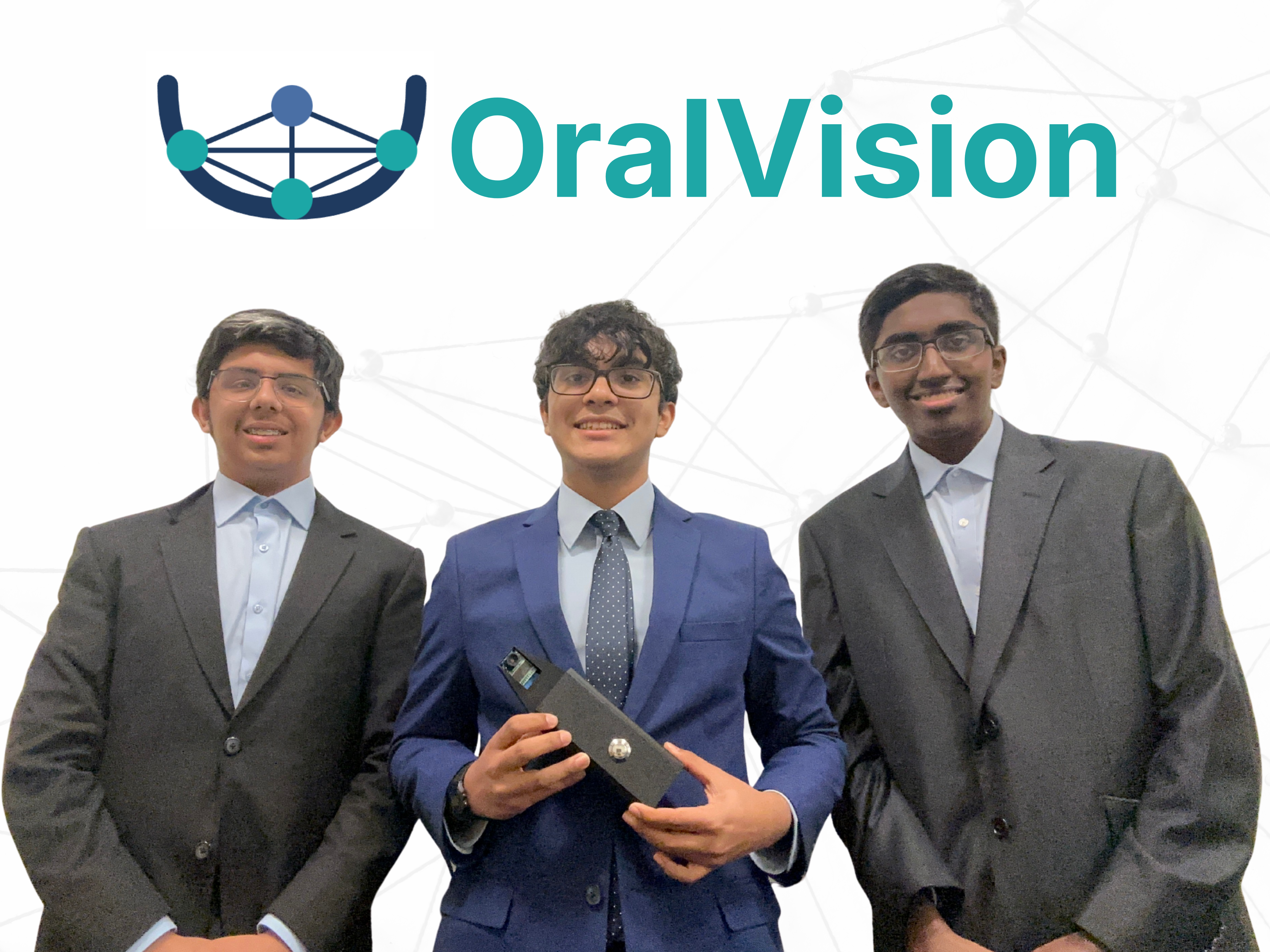 Picture of the OralVision team with me holding the device in the center.